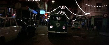 Movie still from “Black Sunday” (1977), directed by John Frankenheimer – A van is driving down the street at night; Wide shot, Low angle