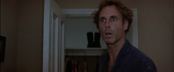 Movie still from “Black Sunday” (1977), directed by John Frankenheimer – A person with a surprised look on his face; Close Up shot, Low angle