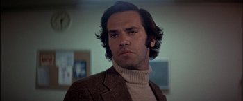 Movie still from “Black Sunday” (1977), directed by John Frankenheimer – A person wearing a jacket; Close Up shot, Low angle