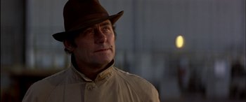 Movie still from “Black Sunday” (1977), directed by John Frankenheimer – A person wearing a hat; Close Up shot, Low angle