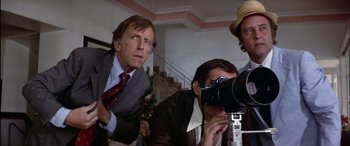 Movie still from “Black Sunday” (1977), directed by John Frankenheimer – A group of people that are taking a picture; Close Up shot, Low angle