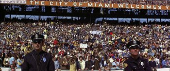 Movie still from “Black Sunday” (1977), directed by John Frankenheimer – A large crowd of people in a stadium; Extreme Wide shot, High angle