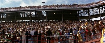 Movie still from “Black Sunday” (1977), directed by John Frankenheimer – A crowd of people in a stadium watching a baseball game; Extreme Wide shot, High angle