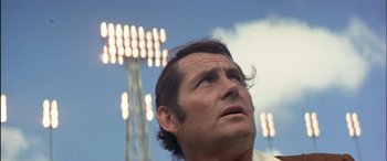 Movie still from “Black Sunday” (1977), directed by John Frankenheimer – A person looking up at the sky; Close Up shot, Low angle