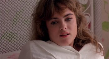 Movie still from “Blame It on Rio” (1984), directed by Stanley Donen – A person wearing a white shirt; Close Up shot, Low angle