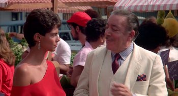 Movie still from “Blame It on Rio” (1984), directed by Stanley Donen – A man and a woman talking to each other outside; Medium shot, Over the shoulder angle