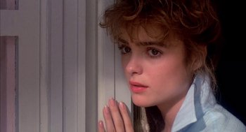 Movie still from “Blame It on Rio” (1984), directed by Stanley Donen – A person with her hands clasped together; Close Up shot, Over the shoulder angle