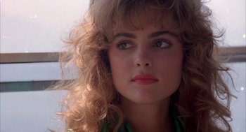 Movie still from “Blame It on Rio” (1984), directed by Stanley Donen – A person wearing a green shirt; Close Up shot, Low angle