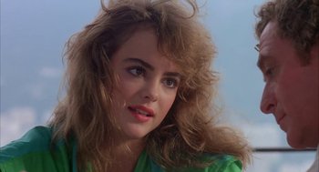 Movie still from “Blame It on Rio” (1984), directed by Stanley Donen – A person with long hair; Close Up shot, Low angle