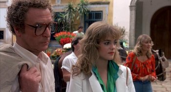 Movie still from “Blame It on Rio” (1984), directed by Stanley Donen – A man and a woman standing next to each other; Close Up shot, Over the shoulder angle