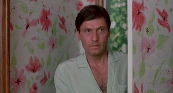 Movie still from “Blame It on Rio” (1984), directed by Stanley Donen – A person wearing a shirt; Close Up shot, Low angle