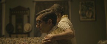 Movie still from “Blaze” (2018), directed by Ethan Hawke – A man and a woman are standing together; Medium shot, Over the shoulder angle