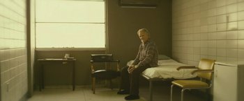 Movie still from “Blaze” (2018), directed by Ethan Hawke – An older man sitting on top of a hospital bed; Wide shot, High angle