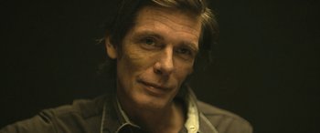 Movie still from “Blaze” (2018), directed by Ethan Hawke – A person wearing a shirt; Close Up shot, High angle