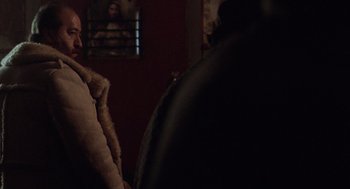 Movie still from “Blind Horizon” (2003), directed by Michael Haussman – A person sitting in a chair in front of a mirror; Close Up shot, Over the shoulder angle