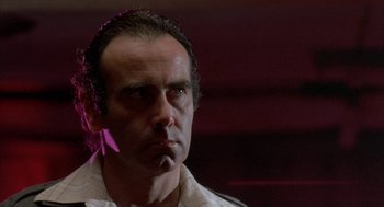 Movie still from “Blood Simple” (1984), directed by Joel Coen – A person with a cigarette in his mouth; Close Up shot, Low angle