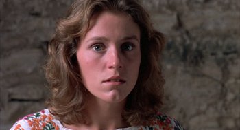 Movie still from “Blood Simple” (1984), directed by Joel Coen – A person with long hair; Close Up shot, High angle