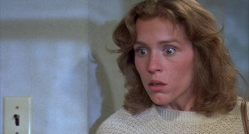 Movie still from “Blood Simple” (1984), directed by Joel Coen – A person wearing a sweater; Close Up shot, High angle
