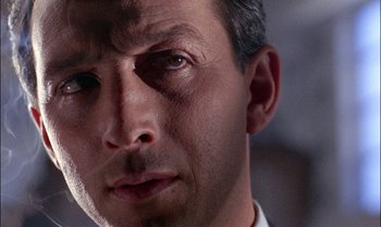 Movie still from “Blood and Black Lace” (1964), directed by Mario Bava – A man's face in a white shirt; Close Up shot, Low angle
