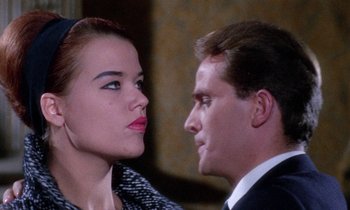 Movie still from “Blood and Black Lace” (1964), directed by Mario Bava – A man and a woman looking at one another; Close Up shot, Low angle