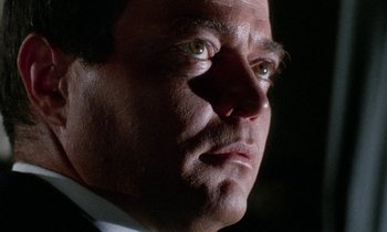 Movie still from “Blood and Black Lace” (1964), directed by Mario Bava – A man's face in the dark; Close Up shot, Low angle