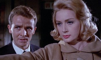 Movie still from “Blood and Black Lace” (1964), directed by Mario Bava – A man and a woman are looking at the camera; Close Up shot, Low angle