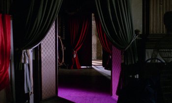 Movie still from “Blood and Black Lace” (1964), directed by Mario Bava – A room that has a purple floor in it; Wide shot, High angle
