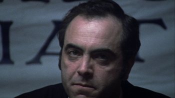 Movie still from “Bloody Sunday” (2002), directed by Paul Greengrass – A person wearing a black shirt; Close Up shot, Low angle