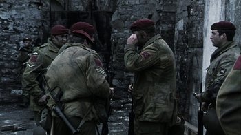 Movie still from “Bloody Sunday” (2002), directed by Paul Greengrass – A group of men standing next to each other; Medium shot, Over the shoulder angle