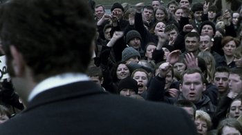 Movie still from “Bloody Sunday” (2002), directed by Paul Greengrass – A group of people in a crowd of people; Medium shot, High angle