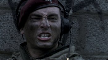 Movie still from “Bloody Sunday” (2002), directed by Paul Greengrass – A man in a military uniform with headphones on; Close Up shot, High angle