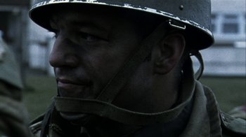 Movie still from “Bloody Sunday” (2002), directed by Paul Greengrass – A person wearing a helmet; Close Up shot, Low angle