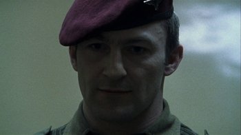 Movie still from “Bloody Sunday” (2002), directed by Paul Greengrass – A person wearing a hat; Close Up shot, Low angle