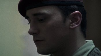 Movie still from “Bloody Sunday” (2002), directed by Paul Greengrass – A person wearing a hat; Close Up shot, Low angle