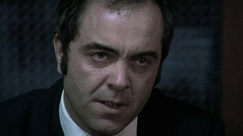 Movie still from “Bloody Sunday” (2002), directed by Paul Greengrass – A person wearing a suit and tie; Close Up shot, Low angle