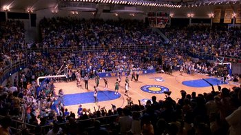 Movie still from “Blue Chips” (1994), directed by William Friedkin – A crowd of people standing around a basketball court; Extreme Wide shot, High angle