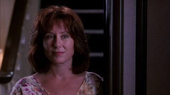 Movie still from “Blue Chips” (1994), directed by William Friedkin – A person wearing a floral shirt; Close Up shot, Low angle