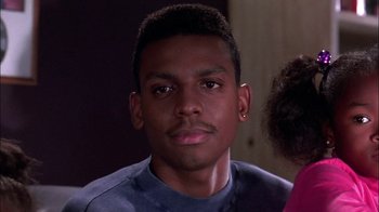 Movie still from “Blue Chips” (1994), directed by William Friedkin – A young man with a piercing is looking at the camera; Close Up shot, Low angle