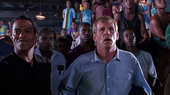 Movie still from “Blue Chips” (1994), directed by William Friedkin – A group of men standing in front of each other; Medium shot, Low angle