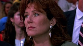 Movie still from “Blue Chips” (1994), directed by William Friedkin – A person wearing a green shirt; Close Up shot, Over the shoulder angle