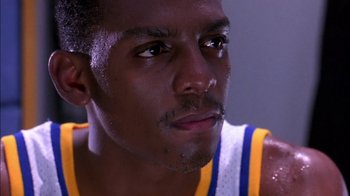 Movie still from “Blue Chips” (1994), directed by William Friedkin – A basketball player's face; Close Up shot, Low angle