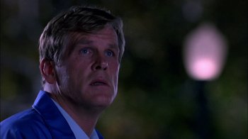 Movie still from “Blue Chips” (1994), directed by William Friedkin – A person with a suit on; Close Up shot, Low angle