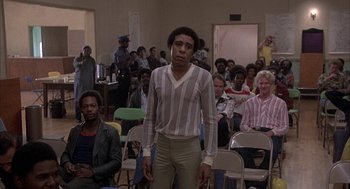 Movie still from “Blue Collar” (1978), directed by Paul Schrader – A man standing in front of a group of people; Medium shot, Low angle