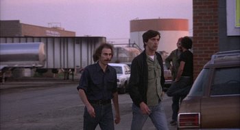 Movie still from “Blue Collar” (1978), directed by Paul Schrader – A group of men walking down a street; Medium shot, Low angle