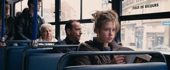 Movie still from “Blue Is the Warmest Colour” (2013), directed by Abdellatif Kechiche – A woman sitting on a bus next to an older man; Close Up shot, Over the shoulder angle
