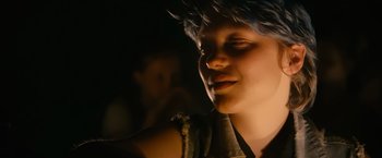 Movie still from “Blue Is the Warmest Colour” (2013), directed by Abdellatif Kechiche – A woman with blue hair is looking into the distance; Close Up shot, Over the shoulder angle