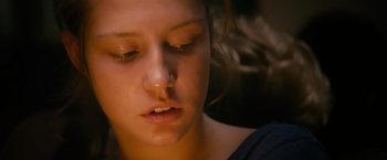 Movie still from “Blue Is the Warmest Colour” (2013), directed by Abdellatif Kechiche – A young woman's face with her eyes closed; Close Up shot, Low angle
