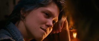 Movie still from “Blue Is the Warmest Colour” (2013), directed by Abdellatif Kechiche – A person's face with a hand on his head; Extreme Close Up shot, Over the shoulder angle