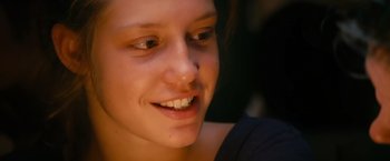 Movie still from “Blue Is the Warmest Colour” (2013), directed by Abdellatif Kechiche – A woman's face with a smile; Close Up shot, Low angle