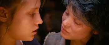 Movie still from “Blue Is the Warmest Colour” (2013), directed by Abdellatif Kechiche – Two women are looking at one another's faces; Close Up shot, Over the shoulder angle